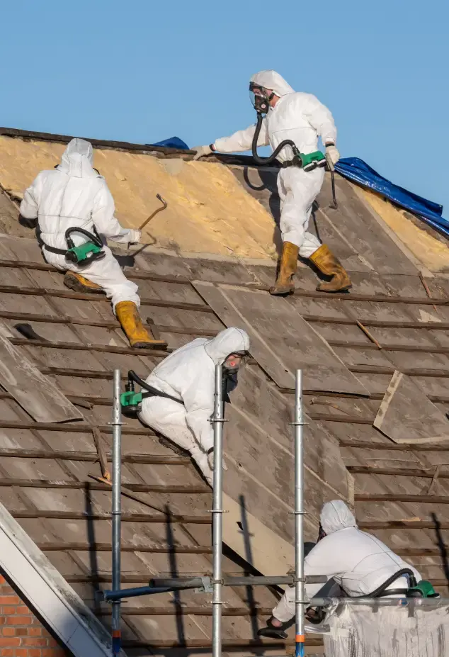 People in PPE removing asbestos