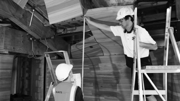 modern joinery construction workers measuring at fletcher building project