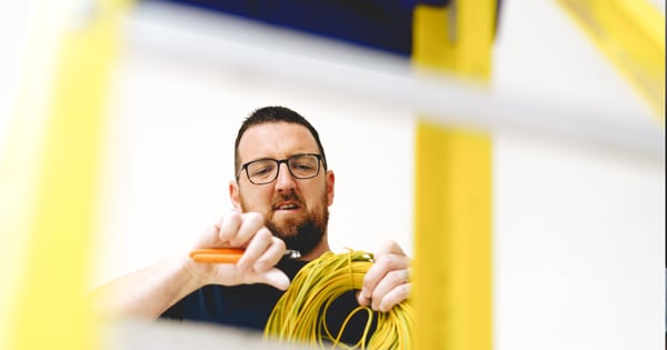 Electrician stripping wire-min