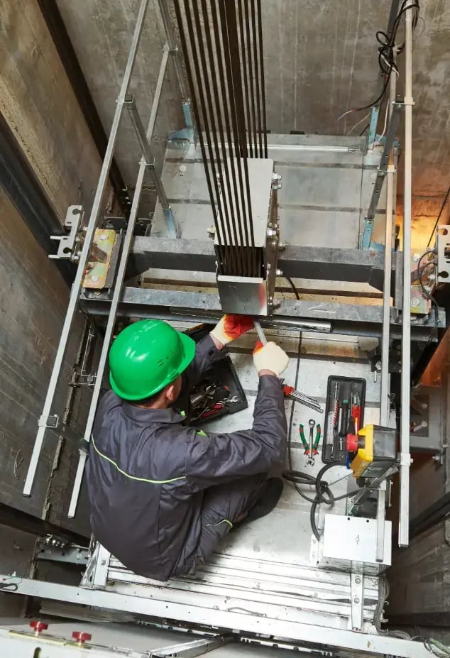 Man fixing an elevator