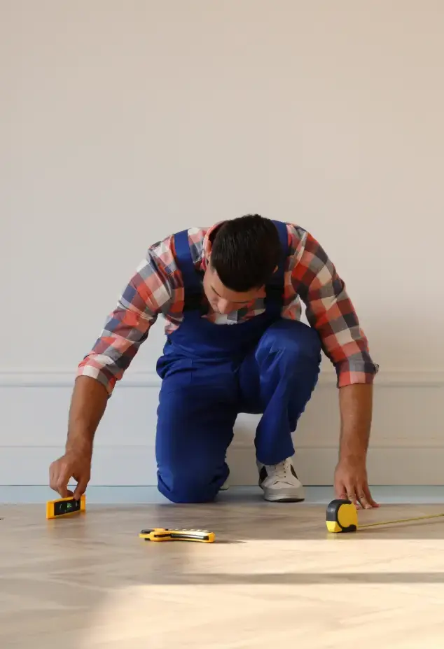 Man installing a wooden floor