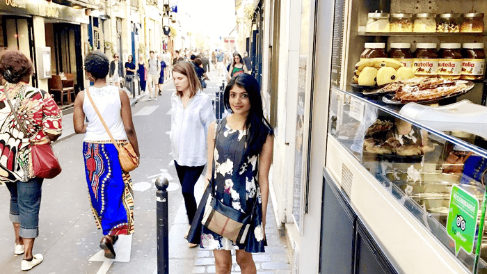 Mat_Sonal_girl in London streets next to shop selling crepes and ice cream 