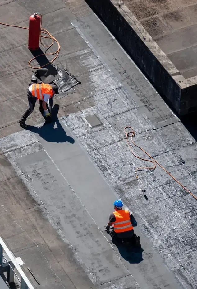 waterproofers waterproofing a roof