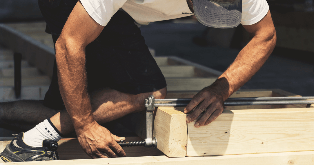 carpenter using g clamp